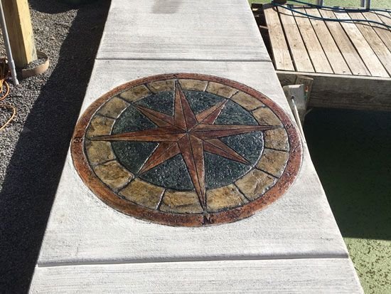 medallion on sidewalk